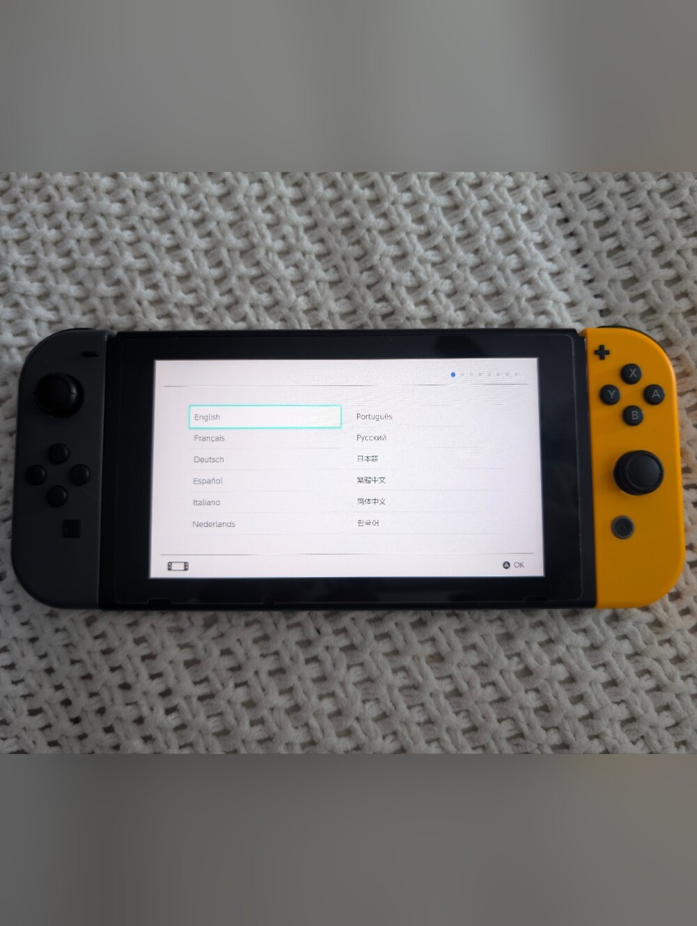 Nintendo Switch Console with Orange and Black Joy-Con (+ Extra Screen Protector)